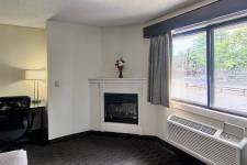 King Two Room fireplace, window, and desk